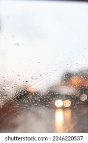 Soft Focus,Raindrops on the windshield are raindrops created by a passing storm and affect visibility when driving on the road because raindrops on the windshield make vision difficult.