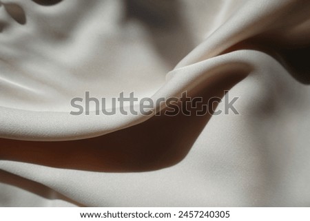 Soft fold on simple light beige rayon fabric