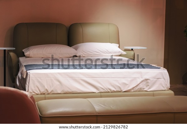 Soft folding\
sofa bed in green color in the\
room.