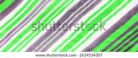 Soft folds of green, white, and gray striped fabric overlap, creating an elegant display of texture and movement. The interplay of light highlights the flowing quality of the material.