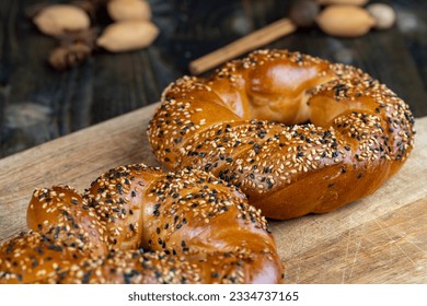 soft and fresh wheat bagel sprinkled with white and black sesame seeds, cooked wheat flour bagels and covered with sesame seeds