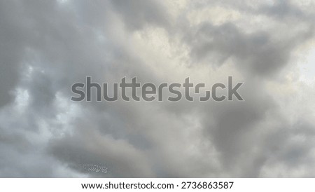 Soft gray clouds covering the sky, creating a calm and moody atmosphere. Natural cloudy sky background suitable for weather concepts, nature themes, climate change visuals, and minimal abstract backgrounds.