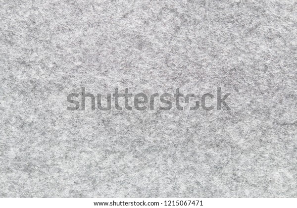 Soft\
grey felt material. Surface of felted fabric texture abstract\
background in gray color. High resolution\
photo.