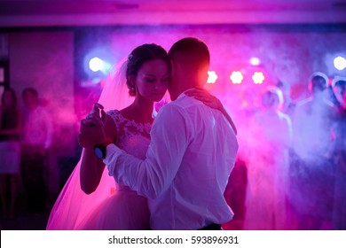Soft hugs of wedding couple dancing in the first time