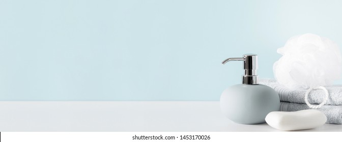 Soft Light Bathroom Decor In Pastel Blue Color, Towel, Soap Dispenser, Accessories On White Wood Shelf. Elegant Decor Bathroom Interior. Banner