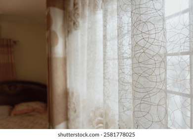 Soft light filtering through sheer curtains in a cozy bedroom