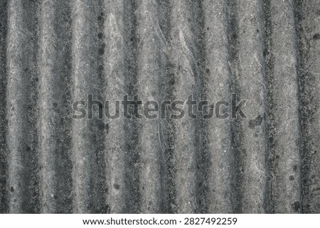 Soft Lighting Highlights The Rough Surface Texture And Natural Wear On Old Cement Board.