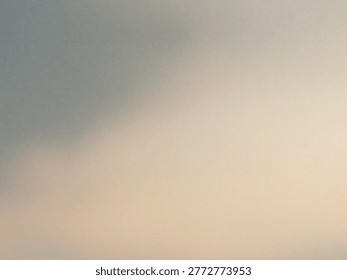 A soft and minimalist abstract gradient background featuring a smooth transition from a cool muted gray to a warm pale peach tone with a subtle grainy texture and out-of-focus effect.