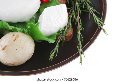 soft mozzarella served with bread on dark plate