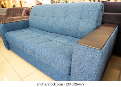 Soft new blue modern comfortable sofa with wooden armrest - Shutterstock ID 2145326479