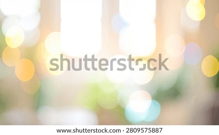 A soft, out-of-focus background featuring warm-toned bokeh lights, creating a gentle and inviting atmosphere.