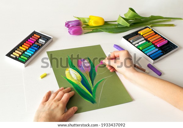 soft pastel drawing, painting of flowers.\
Pastel drawing tulips on paper, top\
view