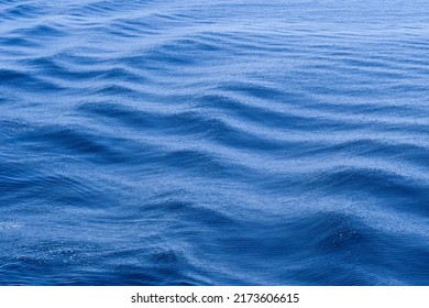 Soft Pattern Effect Of Waves On The Sea With Slow Shutter Speed Used To Blur Motion. Background. No People. Copy Space.