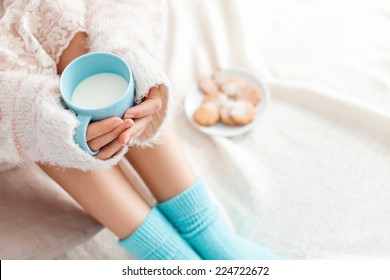 Soft Photo Of Woman On The Bed With Cup Of Milk In Hands, Top View Point. Cozy, Comfy, Soft