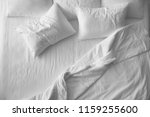 Soft pillows on comfortable bed, top view