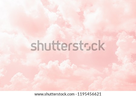 Soft pink clouds floating across the sky creating a dreamy and peaceful atmosphere.