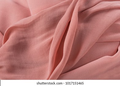 Soft pink fabric shaped as female genital organs, vagina