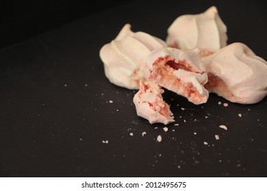 Soft Pink Meringue Cookies And Crumbs. Crispy  Meringue. Meringue Cookies Made From Egg Whites And Sugar. Mini Pavlova Or French Baiser Dessert. Broken Meringues