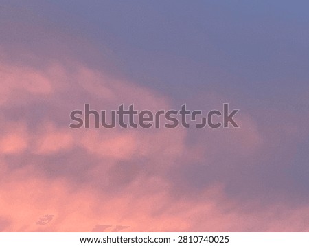Soft Pink Sunset Clouds Creating a Colorful Evening Sky