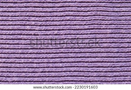 Soft purple color ribbed knitted fabric pattern close up as background
