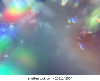 Soft rainbow light flares and glitters background or overlay
