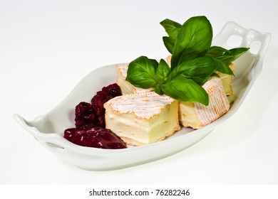 Soft Ripened Cheese With Cumberland Sauce And Basil Leaves