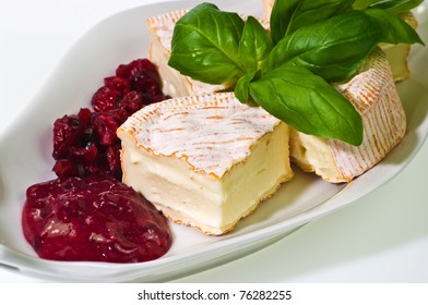 Soft Ripened Cheese With Cumberland Sauce And Basil Leaves