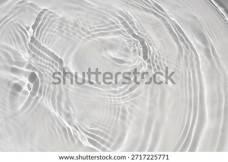 Soft ripples on the surface of clear water.