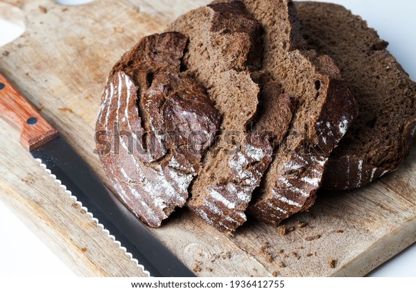 soft rye bread with a crisp crust, fresh and\
delicious rye bread made from rye flour , divided into parts, rye\
fresh loaf of bread