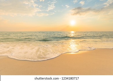 Soft sea waves and bubbles on the beach with sunset sky background. - Powered by Shutterstock