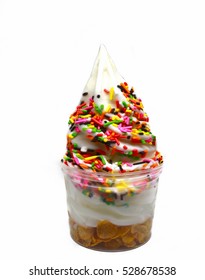 soft serve  ice cream in a cup with topping
