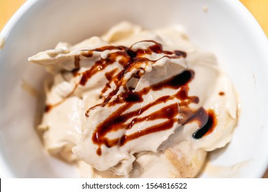 Soft Serve Vanilla Ice Cream Macro Closeup In Bowl Made From Banana Nice Cream Vegan Dessert And Drizzled Balsamic Vinegar Syrup Or Chocolate Sauce