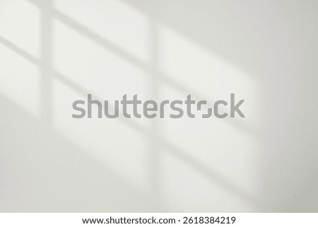 Soft shadow and light from windows on white wall
