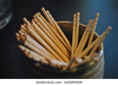 Soft shot of toothpicks in a round canister.