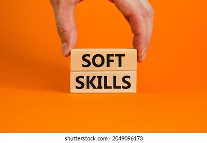 Soft Skills Symbol. Concept Words 'Soft Skills' On Wooden Blocks On A Beautiful Orange Background. Businessman Hand. Business, Educational And Soft Skills Concept, Copy Space.