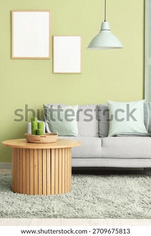 Soft sofa and coffee table in interior of living room