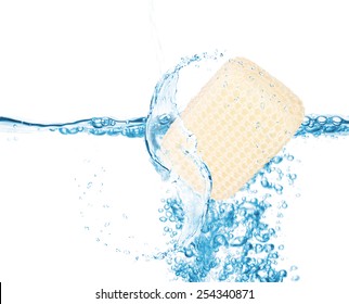 Soft Sponge In Water Splash Isolated On White