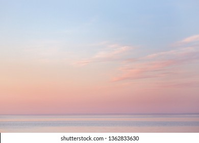 soft summer sunset over the bay,  beautiful horizon pink clouds and water - Powered by Shutterstock