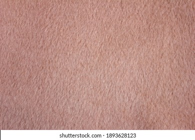 Soft texture from alpaca wool material. Background color dusty rose.