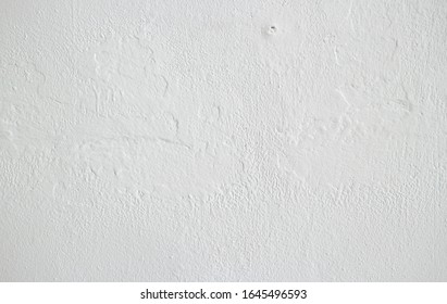 Soft texture of white cement surface as background                               