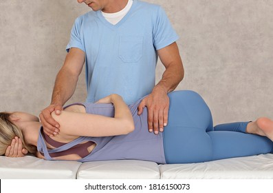 Soft Tissue Massage. Chiropractic Back Adjustment For Female Patient. Physiotherapy, Injury Rehabilitation Concept