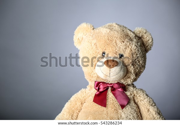 teddy bear with red bow tie
