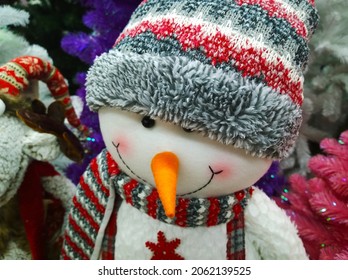 Soft Toy Funny Cheerful Smiling Snowman In Winter Knitted Hat With Carrot Nose. Crafters Virtual Christmas Fair. Cute Handmade Gift Toy. Happy New Year. Xmas Collection. Sewing Doll For Kids. Shopping