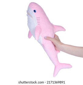 Soft toy pink shark in hand on white background isolation - Powered by Shutterstock