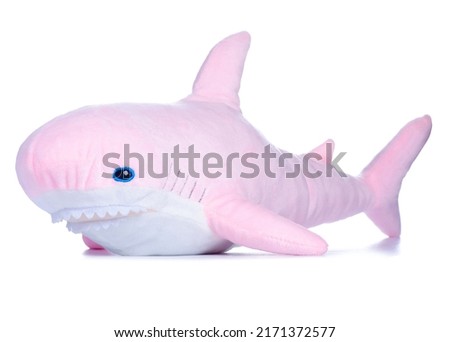 Soft toy pink shark on white background isolation
