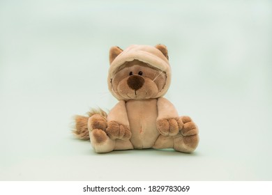 Soft Toy Plush Cat Sitting On A Blue Background