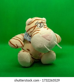 Soft Toy Tiger On A Green Background