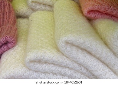 Soft, warm, fluffy knitted shawls.