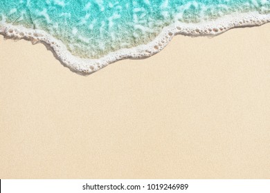 Soft Wave Of Blue Ocean On Sandy Beach. Background.