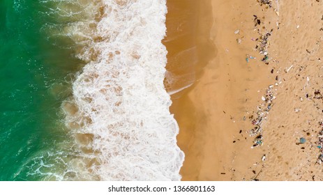 Soft Wave Of Blue Ocean On Sandy Beach With Plastic Garbage And Medical Waste Materials In Andaman Sea Tropical Beach With Emerald Clear Sea - Aerial Top View Photo Taken By Drone